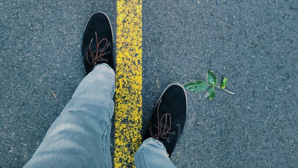 yellow line between feet