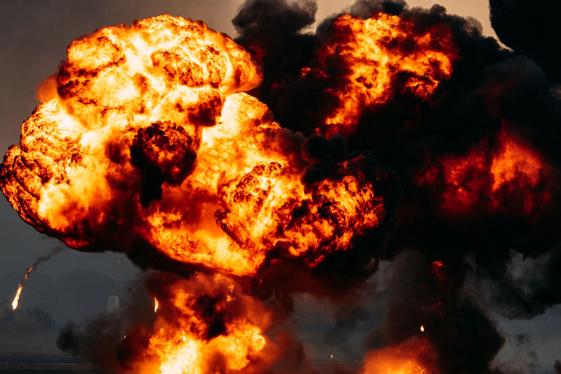dramatic fireball explosion with dark smoke